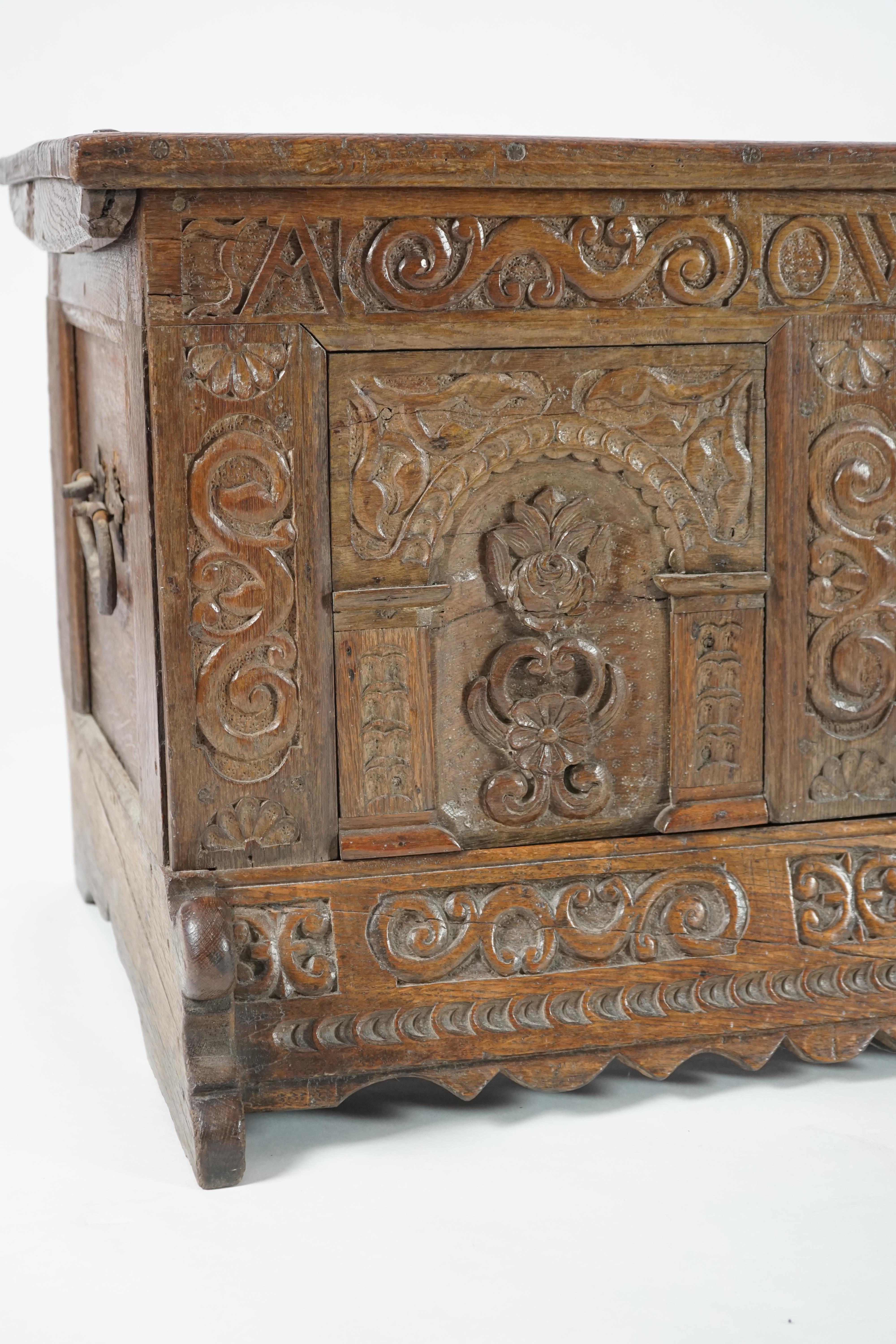 A mid 18th century German carved oak marriage chest